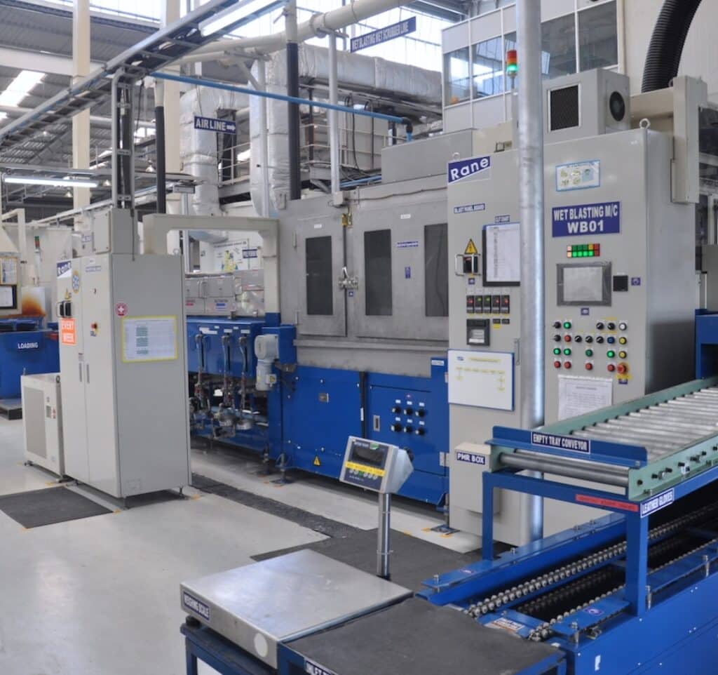 modern brake pad manufacturing facility production line automated equipment