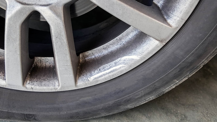 wheel showing minimal brake dust ceramic pads versus metallic alternative
